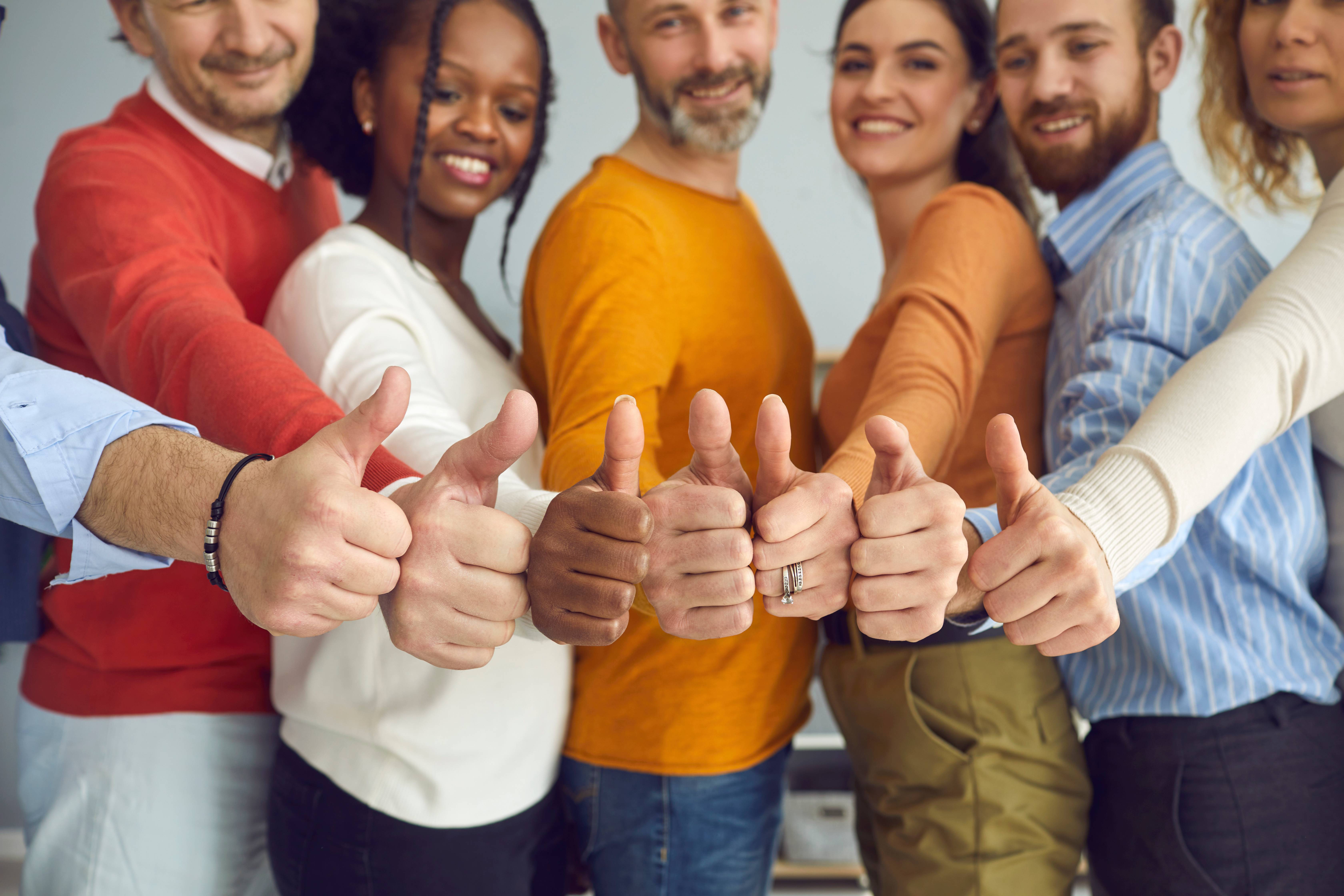 people showing thumbs up in approval.