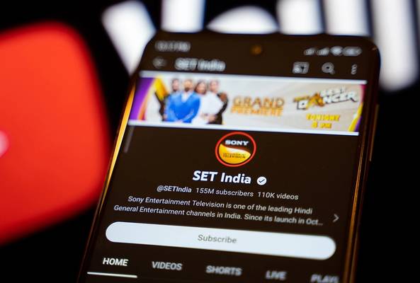 SET India YouTube channel page on phone with subscriber and video count visible.