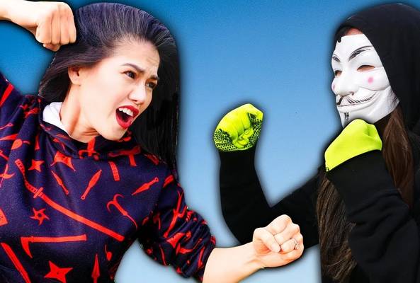 Woman in patterned hoodie angrily confronting masked person in black with neon gloves.